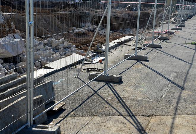 temporary fence panels installed to secure a crowd at a public event